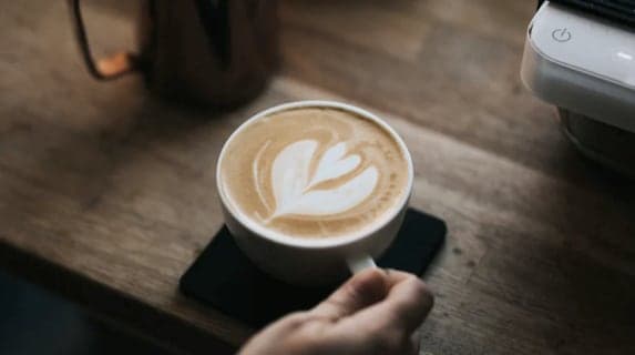 delicious coffee with a heart shape in the foam